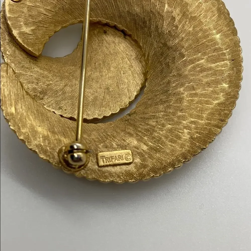 Trifari Gold swirl brooch